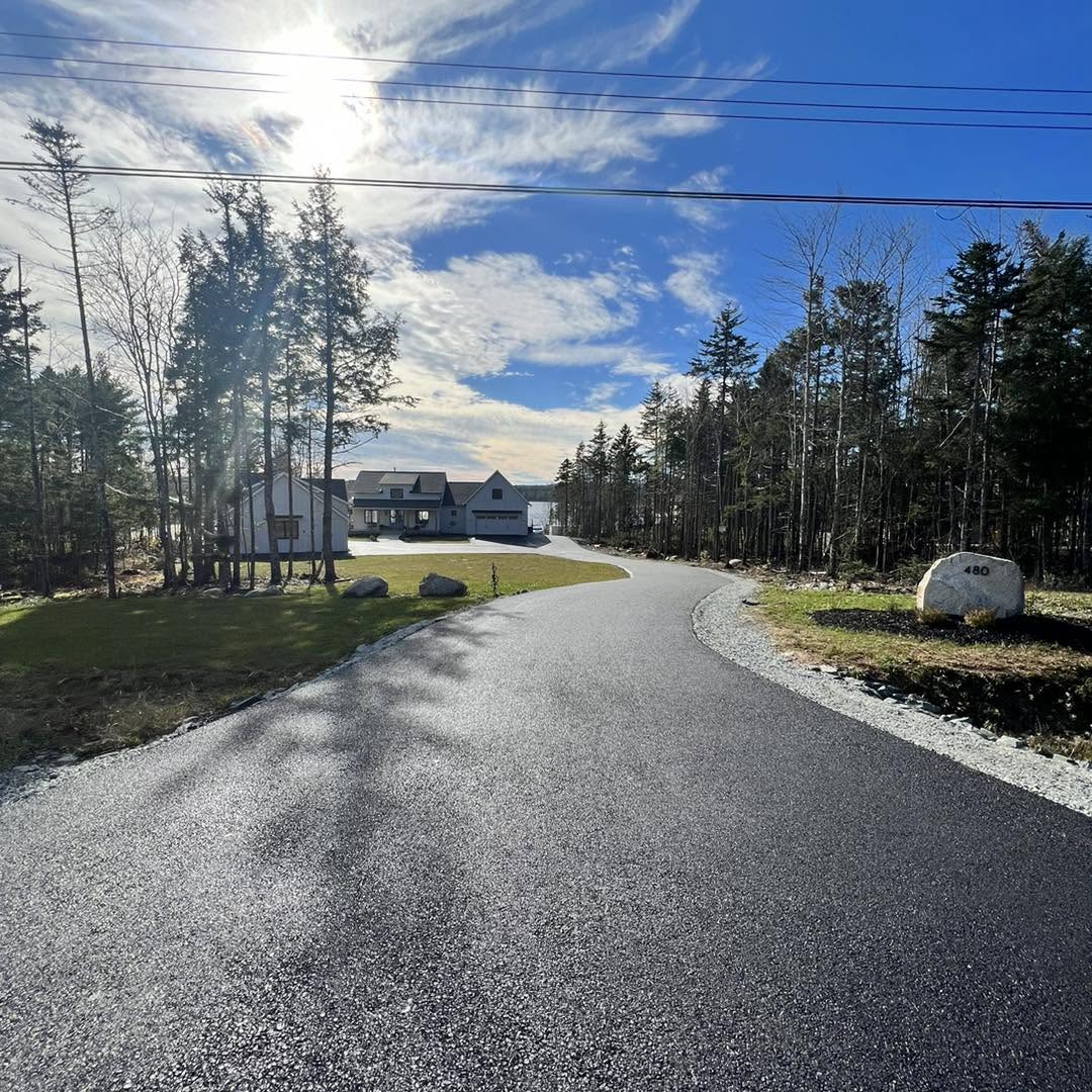 Fresh residential asphalt driveway completed by Empire Paving