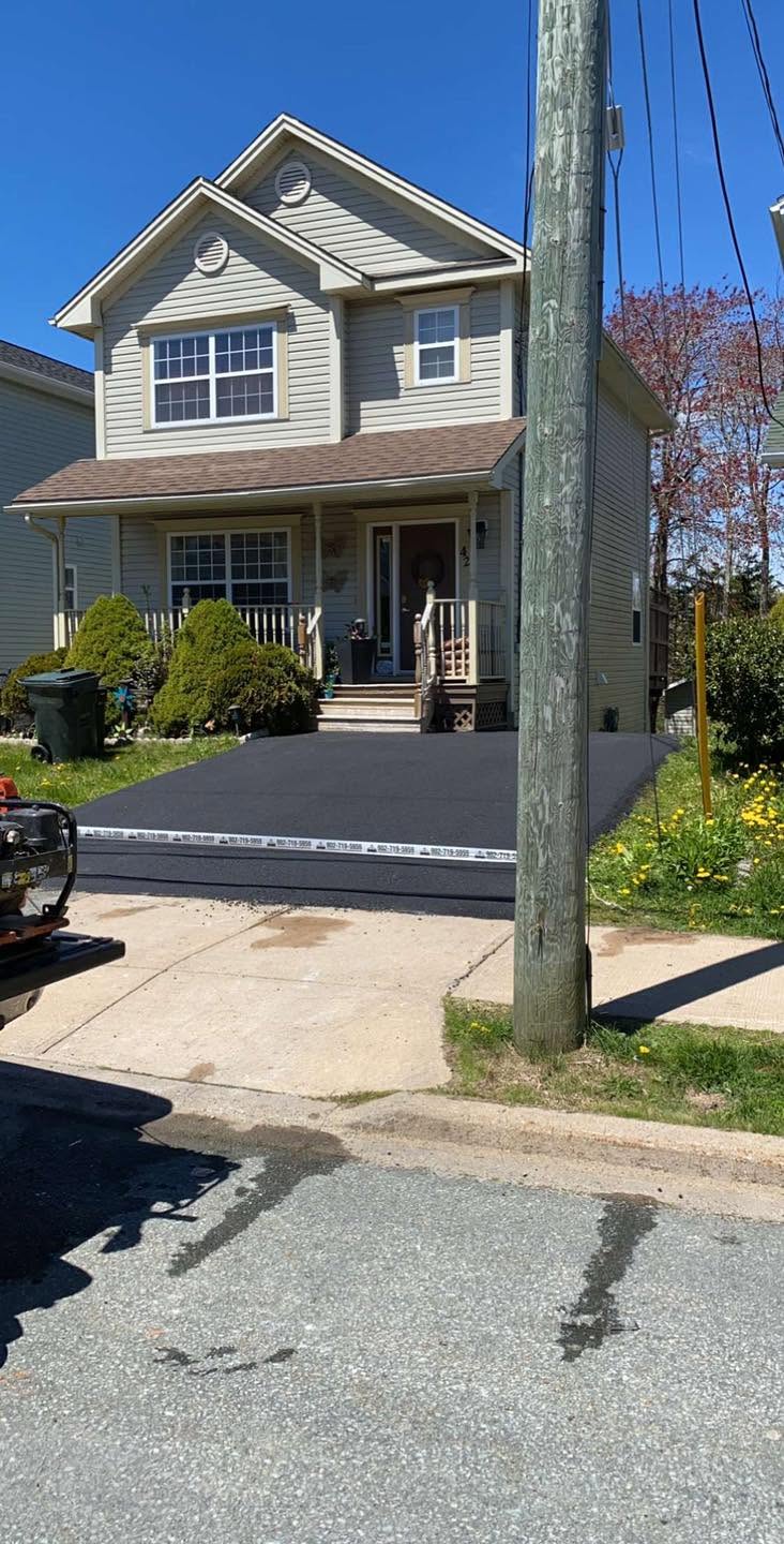 Finished residential asphalt driveway at a Nova Scotia home